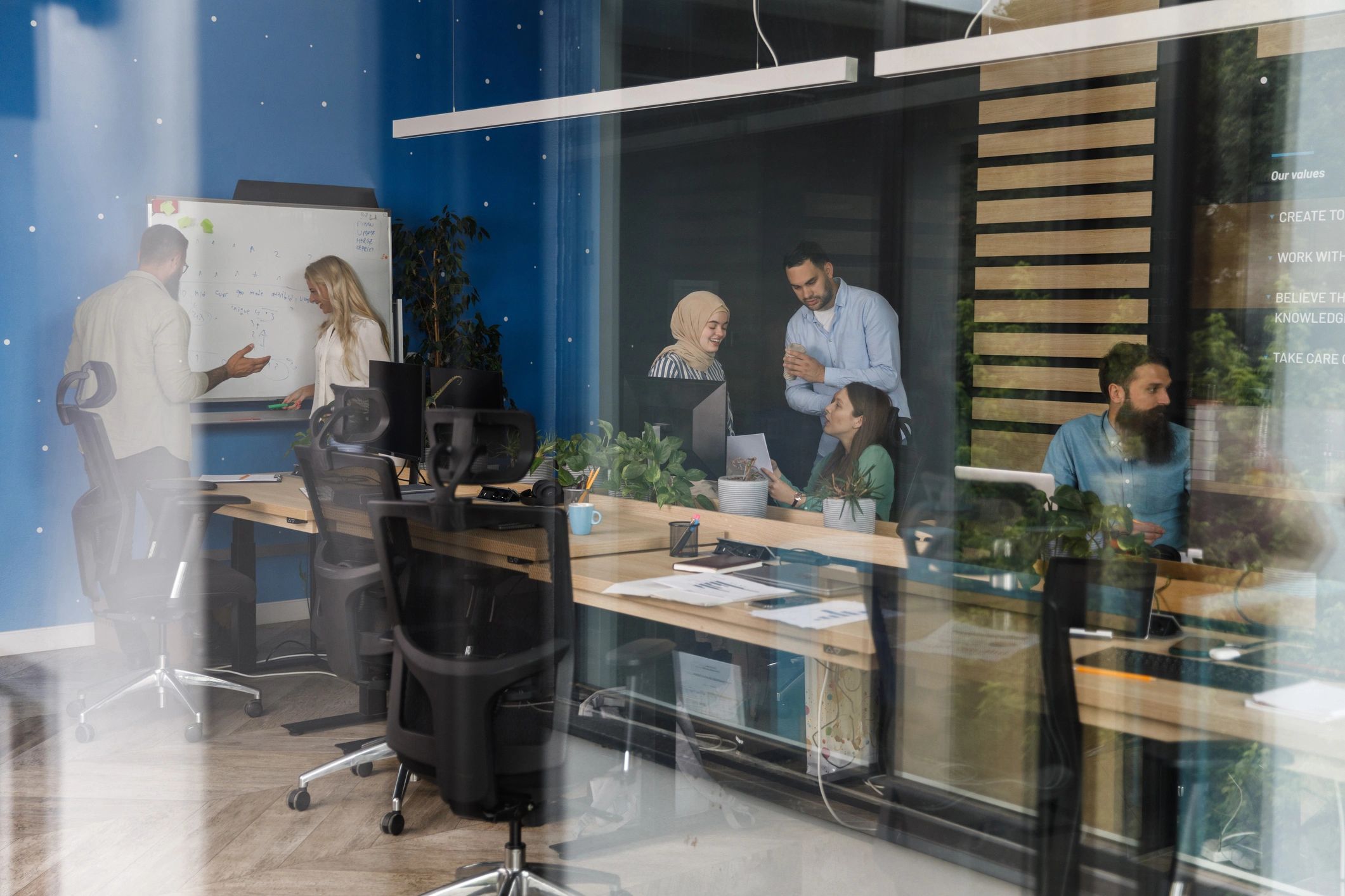 Professional team collaborating on strategy in a modern office